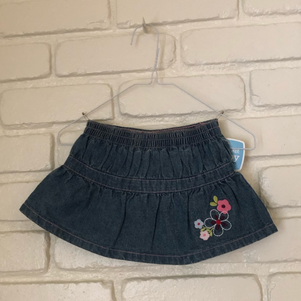 A girls 3m denim skirt, with flowers.